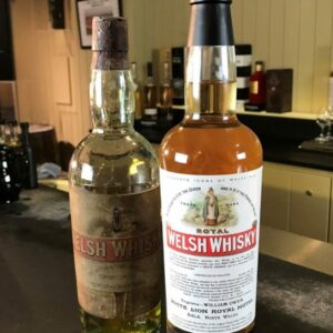 Penderyn-Icons-of-Wales-6-Royal-Welsh-Whisky-next-to-an-original-19th-century-bottle-881×1308